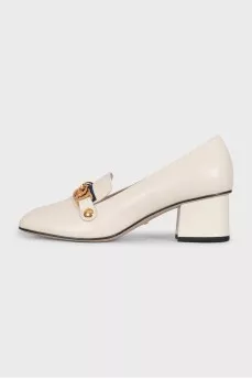 White leather shoes with gold decor