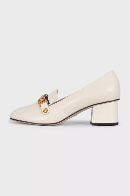 White leather shoes with gold decor
