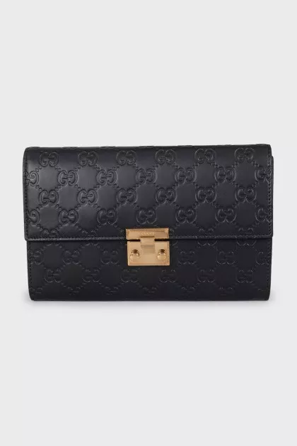 Black leather clutch with embossing