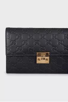 Black leather clutch with embossing