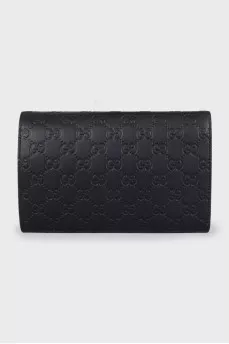 Black leather clutch with embossing