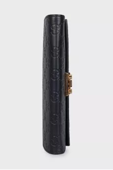 Black leather clutch with embossing