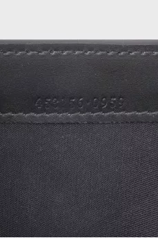 Black leather clutch with embossing