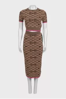 Brown skirt suit with branded print and tag