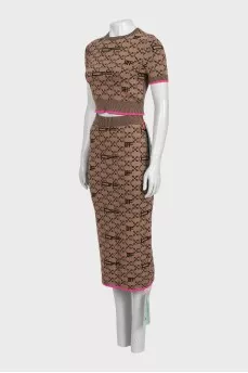 Brown skirt suit with branded print and tag