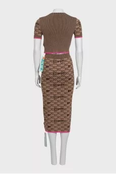 Brown skirt suit with branded print and tag
