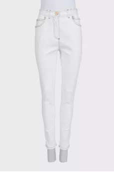 White tapered jeans with black piping