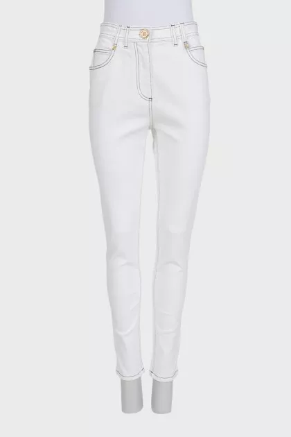 White tapered jeans with black piping