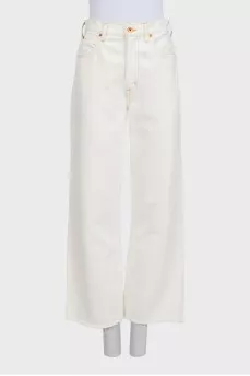 White wide-leg jeans with raw hems