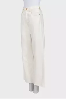 White wide-leg jeans with raw hems