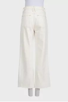 White wide-leg jeans with raw hems