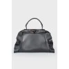 Leather bag with peekaboo frills