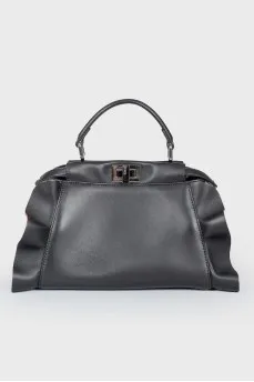 Leather bag with peekaboo frills