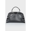 Leather bag with peekaboo frills