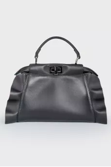 Leather bag with peekaboo frills
