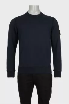 Men's blue sweatshirt with branded patch and tag