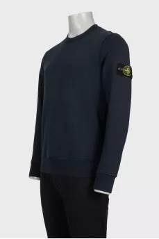 Men's blue sweatshirt with branded patch and tag