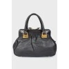 Black leather bag on handles