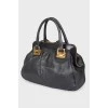 Black leather bag on handles