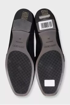 Black suede loafers with embellished strap