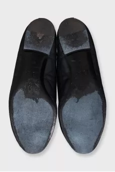 Quilted leather ballet flats decorated with a bow