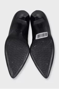 Black leather shoes with stacked heels