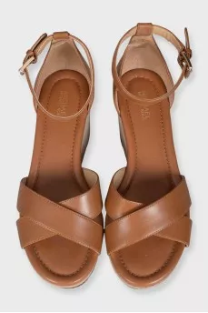 Brown leather sandals with suede wedge heels