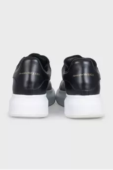 Black leather sneakers with a contrasting sole