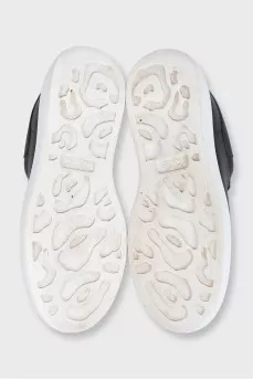 Black leather sneakers with a contrasting sole