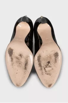 Black leather shoes with gold trim