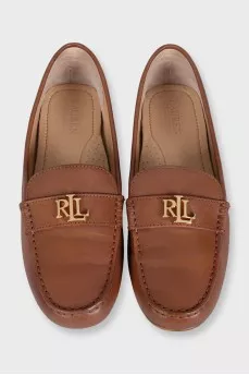 Brown leather loafers with gold logo