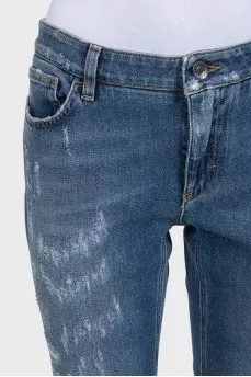 Рвані джинси slim fit синього кольору на середній посадці