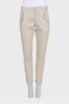 Beige tapered trousers with pockets