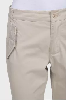 Beige tapered trousers with pockets