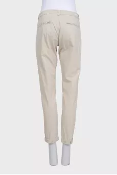 Beige tapered trousers with pockets