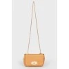 Brown leather bag on a swivel fastener