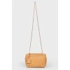 Brown leather bag on a swivel fastener