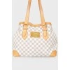 Leather brown bag with brand's branded print
