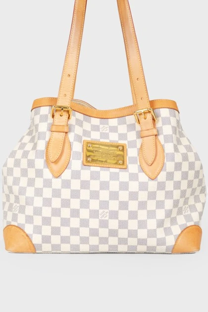 Leather brown bag with brand's branded print