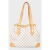 Leather brown bag with brand's branded print
