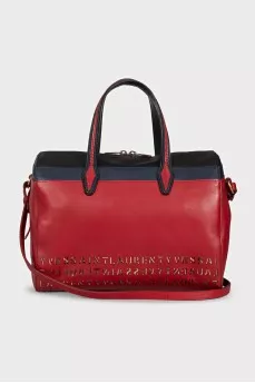 Red leather tote bag decorated with perforations