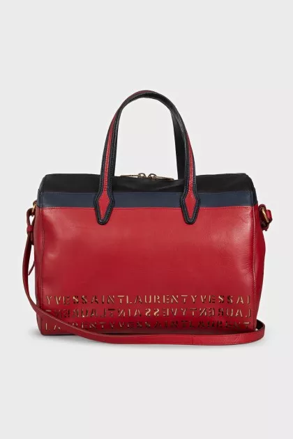 Red leather tote bag decorated with perforations