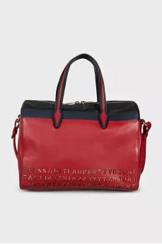 Red leather tote bag decorated with perforations