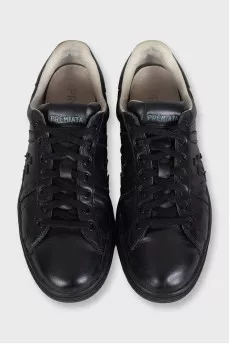 Men's black sneakers decorated with stripes