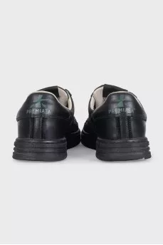 Men's black sneakers decorated with stripes