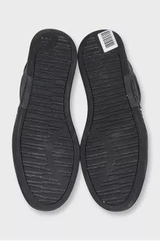 Men's black sneakers decorated with stripes