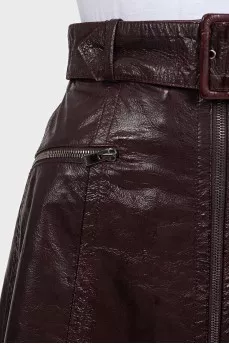 Burgundy leather skirt with belt and tag