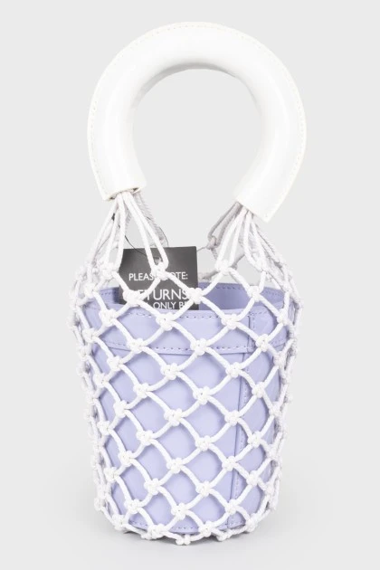 A purple bag with a net and white handles, there is a tag