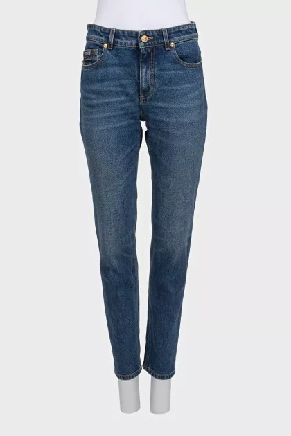 Straight-leg blue jeans with a distressed effect