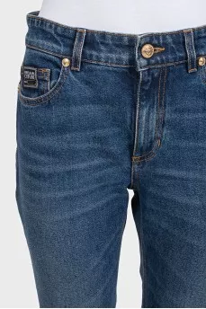 Straight-leg blue jeans with a distressed effect